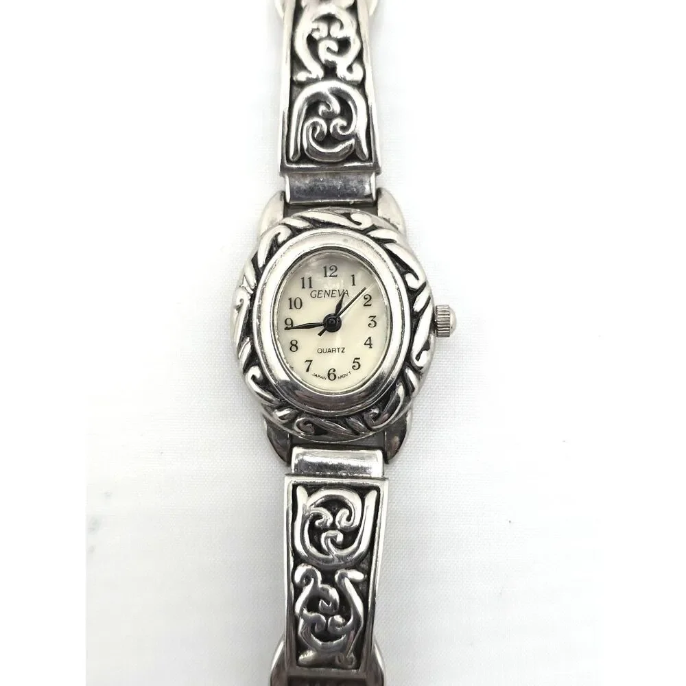 Woman's Geneva Silver Tone Oval Quartz Watch Ornate Bracelet Silver Tone